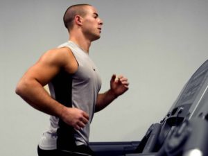 running-on-a-treadmill-thereby-including-some-aerobic-exercising-into-his-regimen-725x544
